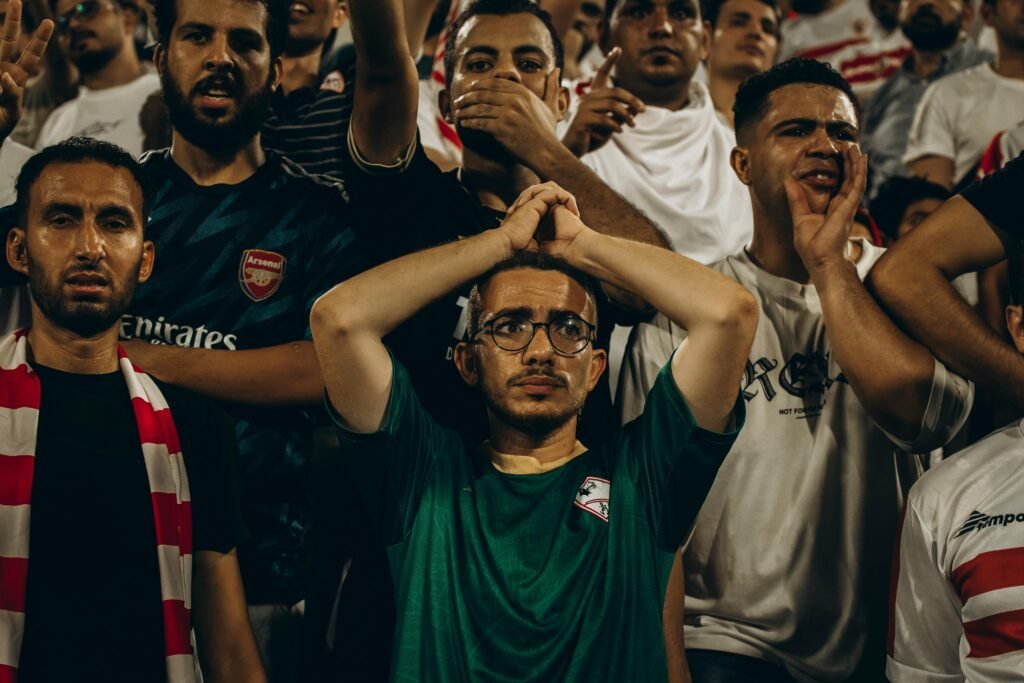 Photo by Eslam Mohammed Abdelmaksoud: https://www.pexels.com/photo/passionate-football-fans-at-a-live-match-31160055/
